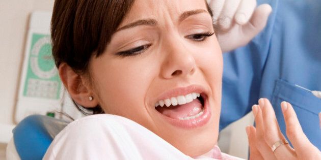 Dentist injecting a patient