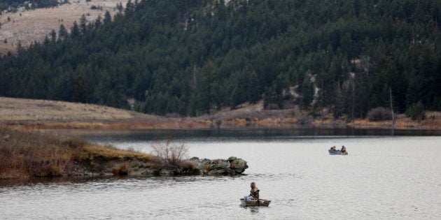 Boaters fish for trout on Jacko Lake, near the site of a proposed expansion of Kinder Morgan's Trans Mountain Pipeline, as well as a proposed Ajax copper mine, in the grasslands on the outskirts of Kamloops, British Columbia, Canada, November 16, 2016. REUTERS/Chris Helgren