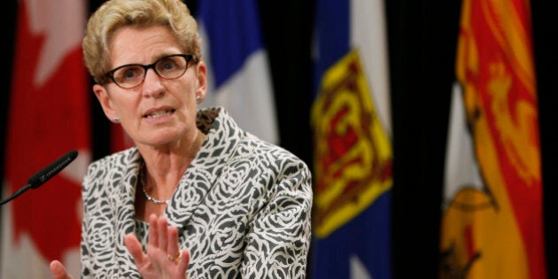 Ontario premier Kathleen Wynne speaks to the media during a news conference during the Council of the Federation summit in Charlottetown, Prince Edward Island, August 28, 2014. REUTERS/Christinne Muschi (CANADA - Tags: POLITICS)