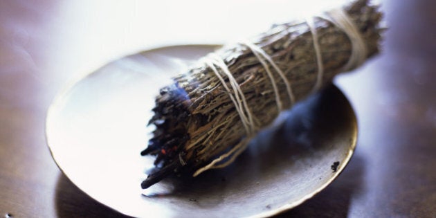 Burning sage bundle purifies