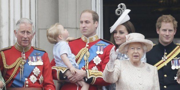 Britain's Prince William holds his son Prince George, with Queen Elizabeth II, 2nd right, Kate, Duchess of Cambridge, the Prince of Wales, left, and Prince Harry, right, during the Trooping The Colour parade at Buckingham Palace, in London, Saturday, June 13, 2015. Hundreds of soldiers in ceremonial dress have marched in London in the annual Trooping the Color parade to mark the official birthday of Queen Elizabeth II. The Trooping the Color tradition originates from preparations for battle, when flags were carried or
