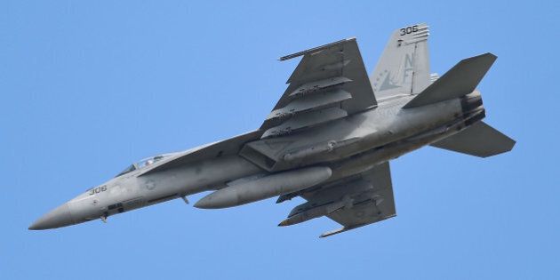 TOWNSVILLE, QUEENSLAND: An F/A 18E Super Hornet from the United States Navy fighter squadron VFA-115 conducts a strafing run on April 6, 2016 in Townsville, Australia. Exercise Black Dagger is a field training exercise held at RAAF Base Townsville and surrounding airspace from 1 to 15 April. The exercise aims to further enhance military co-operation with coalition partners and provides essential training to ensure Army and Air Force personnel are capable of coordinating close air support to soldiers on the ground. (Photo by Ian Hitchcock/Getty Images)