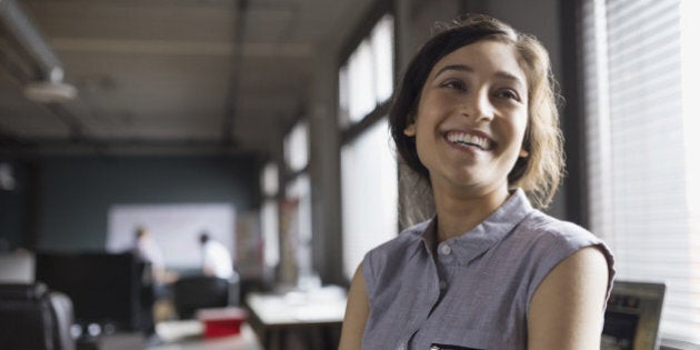 Smiling businesswoman in office