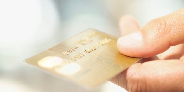 Close up of credit card in man's hand
