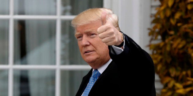 President-elect Donald Trump gives the thumbs up as he arrives at the Trump National Golf Club Bedminster clubhouse, Sunday, Nov. 20, 2016 in Bedminster, N.J.. (AP Photo/Carolyn Kaster)