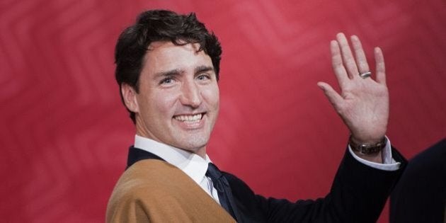 Canada's Prime Minister Justin Trudeau waves during the traditional 'family photo' on the final day of the Asia-Pacific Economic Cooperation (APEC) Summit at the Lima Convention Centre in Lima on November 20, 2016.Asia-Pacific leaders were expected to send a strong message in defense of free trade on November 20 as they wrap up a summit that has been overshadowed by US President-elect Donald Trump's protectionism. / AFP / Brendan Smialowski (Photo credit should read BRENDAN SMIALOWSKI/AFP/Getty Images)