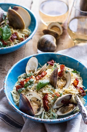 Fresh Clam Pasta With Creamy White Basil Sauce And Crispy Prosciutto