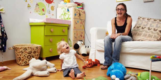 indoor, daughter, casual, mum, vest, jeans, spectacles, ponytail, messy, toy, bedroom, sofa, colourful, open mouth, screaming, playing, large group of objects, looking at camera, looking away, toothy smile, toddler