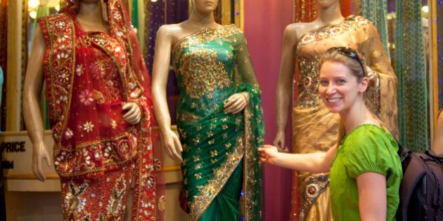 Tourist shopping for a sari in New Delhi