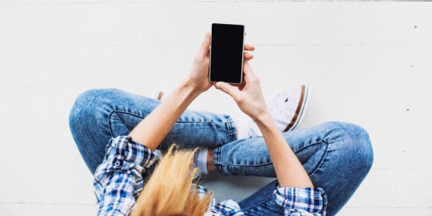 Teenage girl using smart phone