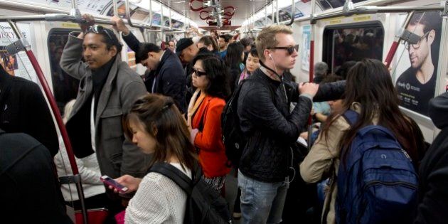 TORONTO, ON - OCTOBER 7: TTC riders aboard the Yonge subway line for Toronto Star story on election issues. TTC subway rush-hour traffic pedestrians Toronto. (Lucas Oleniuk/Toronto Star via Getty Images)