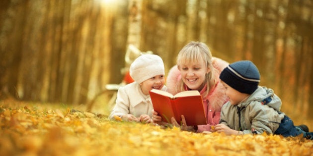 Mother reading book for children