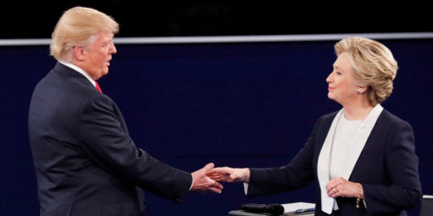 Republican U.S. presidential nominee Donald Trump and Democratic U.S. presidential nominee Hillary Clinton shake hands at the end of their presidential town hall debate at Washington University in St. Louis, Missouri, U.S., October 9, 2016. REUTERS/Jim Young