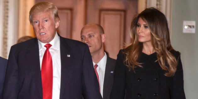 WASHINGTON, DC - NOVEMBER 10:President Elect Donald Trump, center, walks through the halls of th U.S. Capitol for a meeting with Senate Majority Leader Mitch McConnell, left, (R-KY) on November, 10, 2016 in Washington, DC. Accompanying him are his wife, Melania, right, and Vice President Elect Mike Pence, second left.(Photo by Bill O'Leary/The Washington Post via Getty Images)