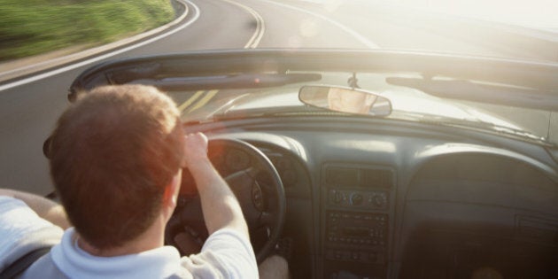 Man Driving Convertible Car