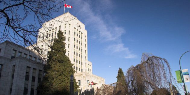 Vancouver City Hall landscape with canada Flag on clear winter day - Vancouver BC