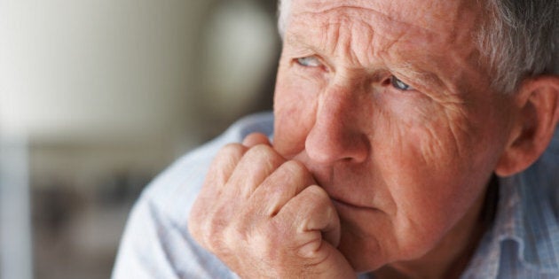 Elderly man lost in thought