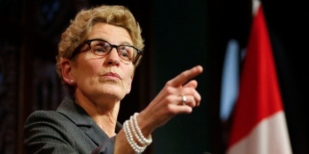 TORONTO, ON - MARCH 26: Premier Kathleen Wynne responds to breach of trust allegations made by Tim Hudak at Queen's Park Thursday evening. March 26, 2014. (Lucas Oleniuk/Toronto Star via Getty Images)
