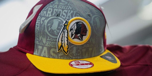 The Washington Redskins football team logo is displayed on a hat for sale at a store in San Francisco, California, U.S., on Wednesday, June 18, 2014. The Washington Redskins lost a trademark decision after a federal agency ruled the team's name disparaged Native Americans, threatening millions of dollars in sales of everything from football jerseys to beer coolers. Photographer: David Paul Morris/Bloomberg via Getty Images