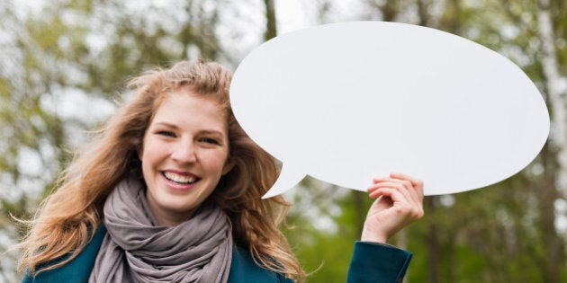 Woman holding a speech bubble