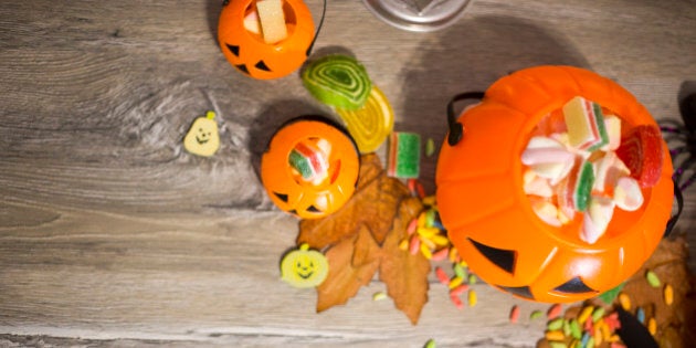 Halloween Jack o Lantern pail overflowing with candy