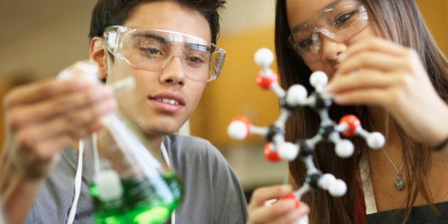 Multi-ethnic teenagers in science class