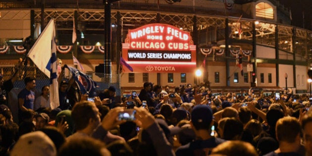 Nov 2, 2016; Chicago, IL, USA; Chicago Cubs fans celebrate after game seven of the 2016 World Series against the Cleveland Indians outside of Wrigley Field. Cubs won 8-7. Mandatory Credit: Patrick Gorski-USA TODAY Sports