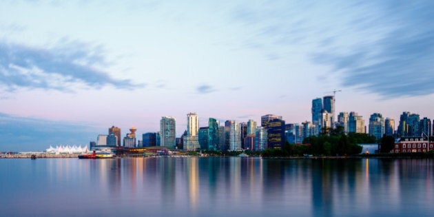 Vancouver skyline at sunset as seen from Stanley Park, British Columbia, Canada