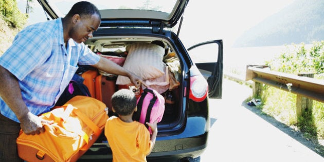 Father and son loading car