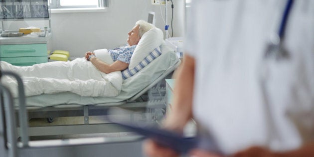 Senior woman lying in icu