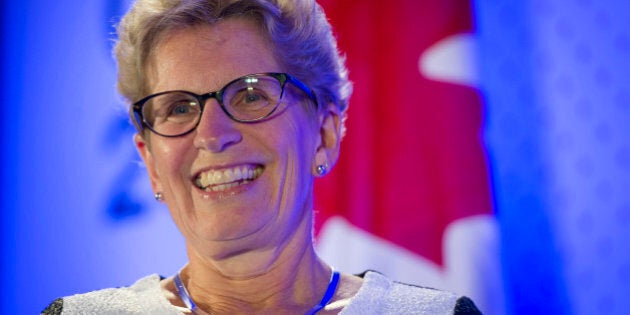 Kathleen Wynne, premier of Ontario, smiles during an interview at the Bloomberg Canada Economic Summit in Toronto, Ontario, Canada, on Thursday, May 21, 2015. The investment banking fee structure for the initial public offering of Hydro One Inc. hasn't been finalized, despite 'speculation' about the process, Wynne said today. Photographer: Kevin Van Paassen/Bloomberg via Getty Images