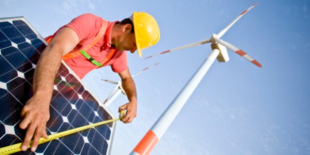 Image of a worker measuring a solar panel. In the background you can see Wind Turbines. Two different technologies to produce energy in a responsible and sustainable way (ISO 100) . All my images have been processed in 16 Bits and transfer down to 8 before uploading.