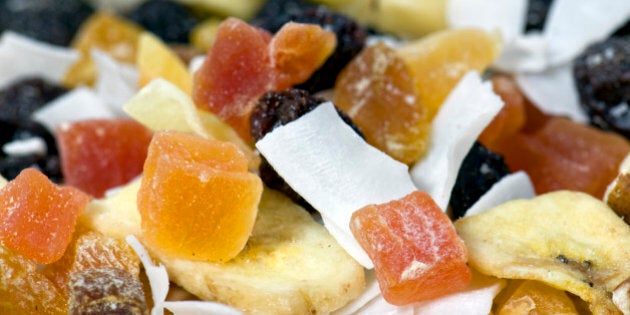 Close up of dried fruit, nut and coconut, often called trail mix.