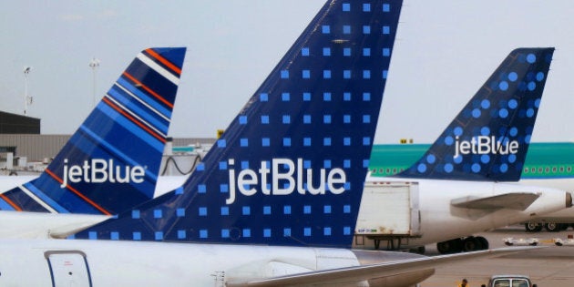 JetBlue Airways aircrafts are pictured at departure gates at John F. Kennedy International Airport in New York June 15, 2013. REUTERS/Fred Prouser/File Photo