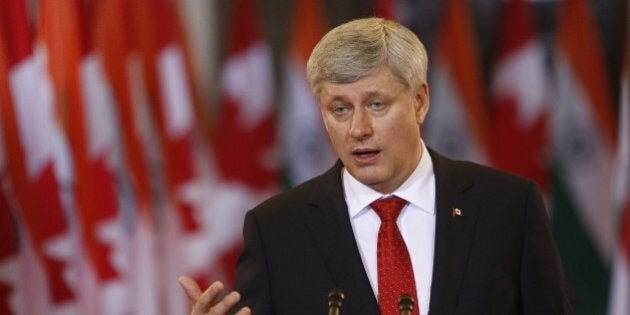 Canada's Prime Minister Stephen Harper speaks alongside India's Prime Minister Narendra Modi (not pictured) on Parliament Hill in Ottawa, Canada on April 15, 2015. Prime Minister Modi will continue his official visit to Canada in Toronto and Vancouver. AFP PHOTO/ COLE BURSTON (Photo credit should read Cole Burston/AFP/Getty Images)