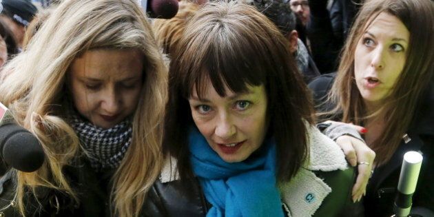 Actress Lucy DeCoutere, a complainant in the case against former Canadian radio host Jian Ghomeshi, leaves the court after an Ontario judge found him not guilty on four sexual assault charges and one count of choking, in Toronto, March 24, 2016. REUTERS/Mark Blinch