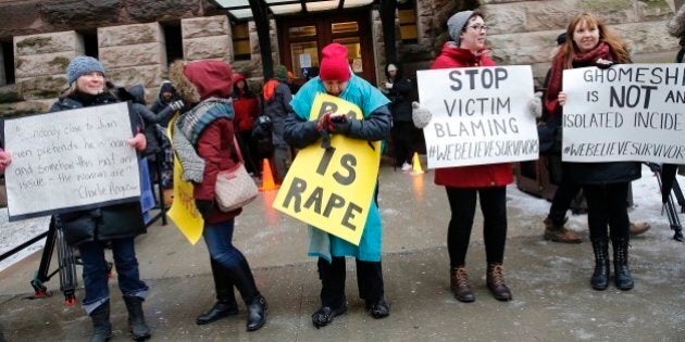 TORONTO, ON - MAR 24. Protesters ready for the verdict at the back door. Ghomeshi verdict. Cleared of all charges. Marie Henein, defence attorney for former CBC host Jian Ghomeshi was successful in this high profile case. (Rene Johnston/Toronto Star via Getty Images)