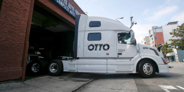 One of Otto's self-driving, big-rig trucks leaves the garage for a test drive during a demonstration at the Otto headquarters on Thursday, Aug. 18, 2016, in San Francisco. Uber announced that it is acquiring self-driving startup Otto, which has developed technology allowing big rigs to drive themselves. (AP Photo/Tony Avelar)