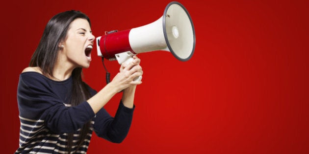 young woman shouting with a...