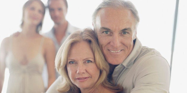 Mature couple with younger couple in background