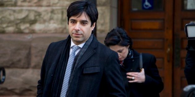 TORONTO, ON - FEBRUARY 11: Jian Ghomeshi (middle) leaves with co counsel Danielle Robitaille (left) and lawyer Marie Henein. Jian Ghomeshi exits the courthouse after his trial arguments ended. The verdict is to come March 24. (Carlos Osorio/Toronto Star via Getty Images)