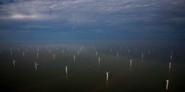 Wind turbines sit in the North Sea at the London Array offshore wind farm, a partnership between Dong Energy A/S, E.ON AG and Abu Dhabi-based Masdar, in the Thames Estuary, U.K., on Tuesday, Oct. 27, 2015. The London Array, east of London, has 175 Siemens turbines and a capacity of 630MW. Photographer: Simon Dawson/Bloomberg via Getty Images