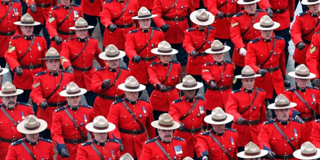 TORONTO, ON - JAN. 18: The RCMP red surge arrives at the Metro Toronto Convention Center for the day's activities surrounding the color funeral for a fallen Toronto Police officer. Sgt. Ryan Russell was struck and killed by a stolen snowplow early on Wednesday morning last week, leaving behind his wife Christine and two-year-old son Nolan. (Rene Johnston/Toronto Star via Getty Images)