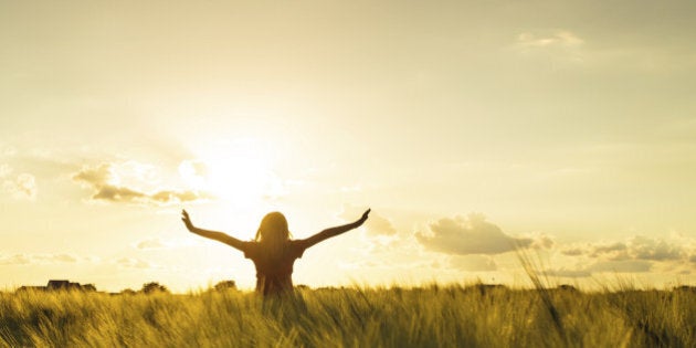 Teenage girl enjoy with sun in the evening glow