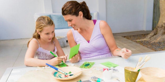 Woman teaching her daughter