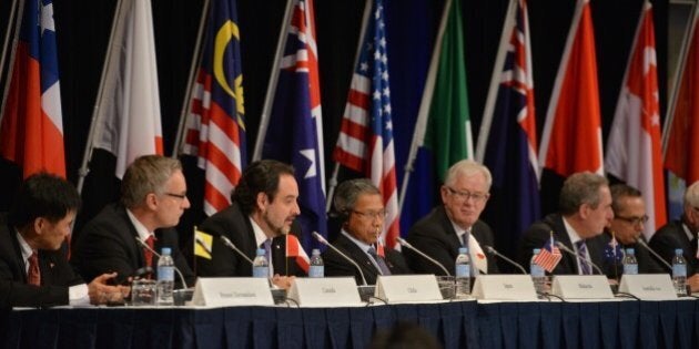 Trade representatives attend at a press conference for the Trans-Pacific Partnership (TPP), a pan-Pacific trade agreement by trade ministers from 12 nations in Sydney on October 27, 2014. The TPP, which would encompass 40 percent of the global economy and include 12 nations, has been the subject of negotiations for years. AFP PHOTO/Peter PARKS (Photo credit should read PETER PARKS/AFP/Getty Images)