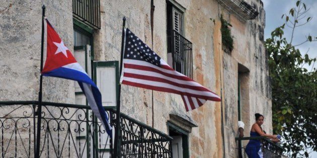 Cuban and US flags are seen on balconies in Havana on March 20, 2016. On Sunday, Obama became the first US president in 88 years to visit Cuba, touching down in Havana for a landmark trip aimed at ending decades of Cold War animosity. AFP PHOTO/YAMIL LAGE / AFP / YAMIL LAGE (Photo credit should read YAMIL LAGE/AFP/Getty Images)
