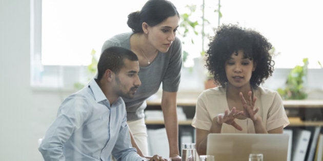 Cropped shot of a group of business colleagues meeting in the boardroom