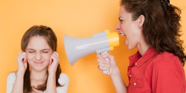 Mother yelling at daughter (10-11 years) through megaphone