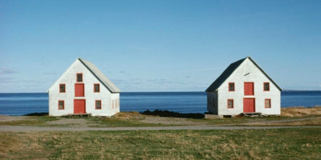 Twin houses by ocean, Magdalen Island, Quebec, Canada